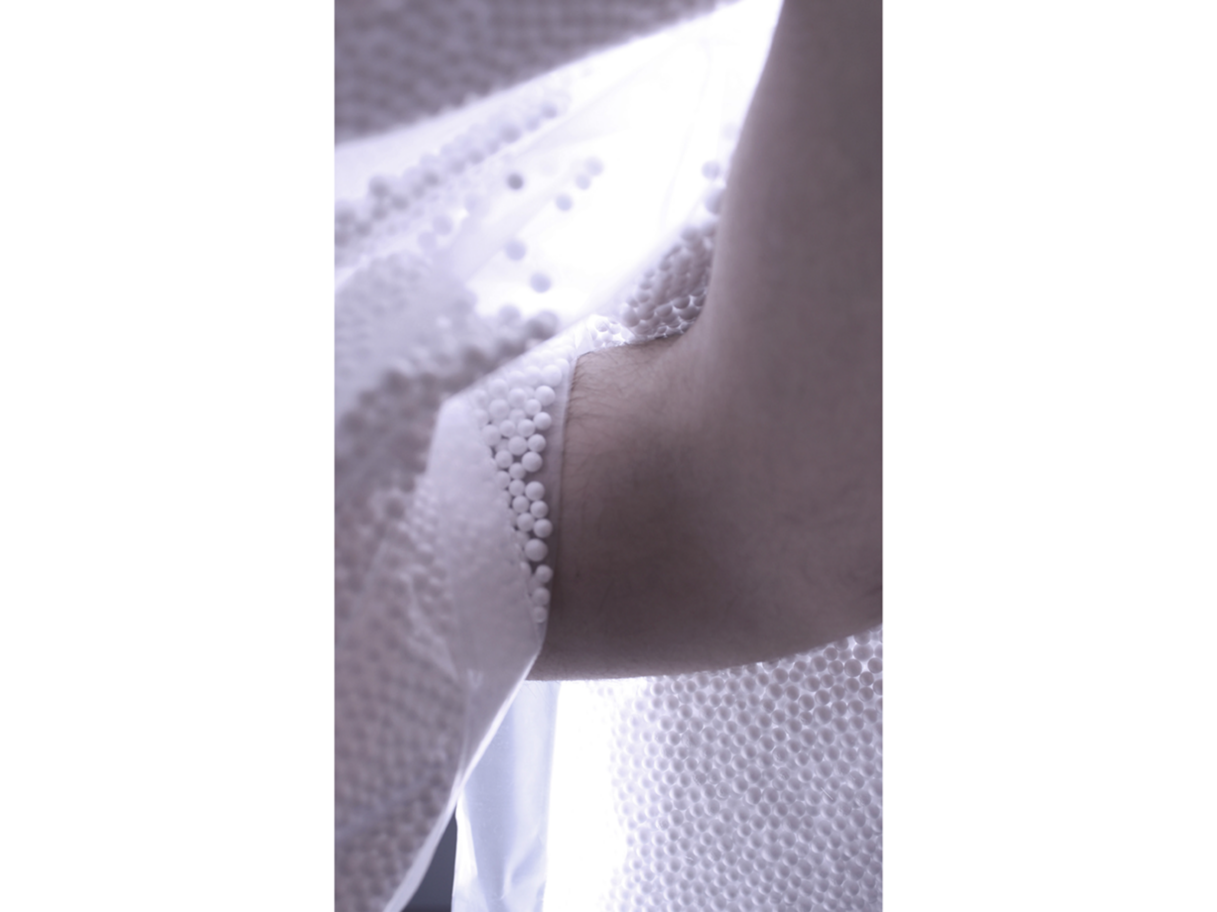 Arm intersects with panel.