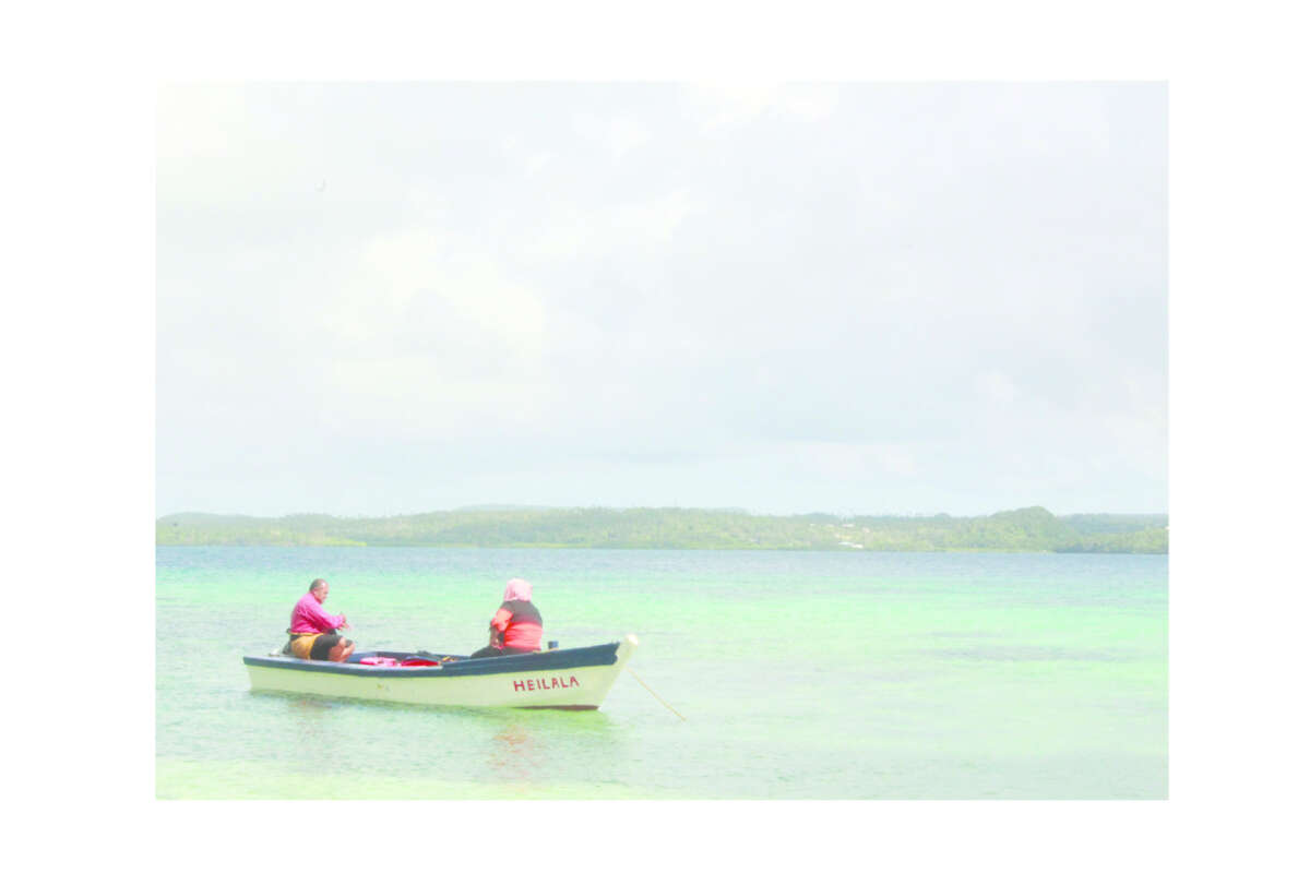 Two Men One Boat In Ofu